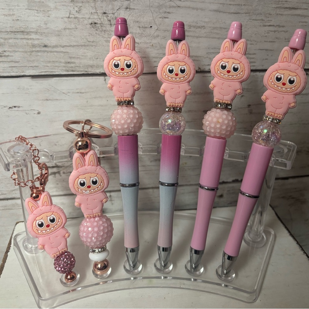Labubu pens, keychains, and Stanley charms